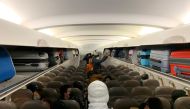 Filipinos, voluntarily evacuated due to the coronavirus outbreak, board a plane from Wuhan, Hubei, China, February 9, 2020. Courtesy of Department of Foreign Affairs/Handout via REUTERS 