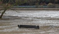 A park bench is flooded by the river Moselle due to heavy rainfalls in western Europe in Winning near Koblenz, Germany, February 4, 2020. REUTERS/Wolfgang Rattay