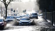 Cars drive through floodwater as hurricane-force winds and rain affected the country's transport network leading to disruptions and prompting warnings of power cuts and a risk to life, in Manchester, Britain February 9, 2020. Reuters/Jon Super
 