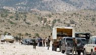 Representative image (Tunisian soldiers stand guard in the mountainous border region near Algeria where security forces have been hunting Al-Qaeda linked jihadists on June 6, 2013. AFP / Abderrazek Khlifi)