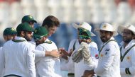 Pakistan's cricketers celebrater after the dismissal of Bangladesh's Mominul Haque during the fourth day of the first cricket Test match between Pakistan and Bangladesh at the Rawalpindi Cricket Stadium in Rawalpindi on February 10, 2020. / AFP / AAMIR QU