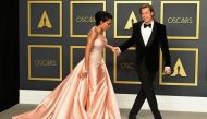 US actor Brad Pitt poses in the press room with the Oscar for Best Supporting Actor along with actress US actress Regina King during the 92nd Oscars at the Dolby Theater in Hollywood, California on February 9, 2020. AFP / FREDERIC J. BROWN