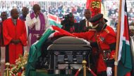  Military officers prepare the coffin of late former Kenya's President Daniel Arap Moi draped in the national flag during a memorial service at the Nyayo Stadium in Nairobi, Kenya February 11, 2020. REUTERS/Njeri Mwangi 