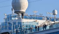 Passengers are seen on the deck of the Diamond Princess cruise ship, with around 3,600 people quarantined onboard due to fears of the new coronavirus, at the Daikaku Pier Cruise Terminal in Yokohama port on February 13, 2020. AFP / Kazuhiro Nogi 