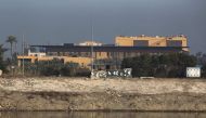 (FILES) In this file photo taken on January 03, 2020, a view of the US embassy across the Tigris river in Iraq's capital Baghdad.  AFP / AHMAD AL-RUBAYE
