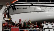 Passengers onboard MS Westerdam, a cruise ship that spent two weeks at sea after being turned away by five countries over fears that someone aboard might have the coronavirus, are seen in Sihanoukville, Cambodia February 14, 2020. REUTERS/Soe Zeya Tun/Fil