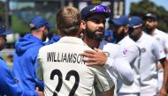 New Zealand's captain Kane Williamson (L) hugs India's captain Virat Kohli after New Zealand's win during day four of the first Test cricket match between New Zealand and India at the Basin Reserve in Wellington on February 24, 2020. / AFP / Marty MELVILL