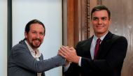 Pedro Sanchez is congratulated by Spanish far-left Unidas Podemos coalition leader Pablo Iglesias after winning vote to elect a premier at the Spanish Congress in Madrid on January 7, 2020. AFP / Pierre-Philippe Marcou