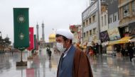 A man wears a respiratory mask after deaths and new confirmed cases revealed from the coronavirus in Qom, Iran on February 25, 2020. (Anadolu Agency)