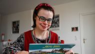 Eleonore Laloux, a young woman with Down syndrome, poses at her home in Arras, northern France, on February 13, 2020. AFP / DENIS CHARLET