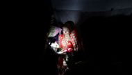 Savitri Prasad, a 23-year-old bride, takes her wedding vows inside her parents' house in a riot affected area following clashes between people demonstrating for and against a new citizenship law in New Delhi, India, February 26, 2020. REUTERS/Adnan Abidi
