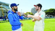New Zealand's Kane Williamson talks to India's Virat Kohli after New Zealand beat India in the First Test. Reuters/Martin Hunter 