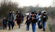 Migrants arrive to cross the Evros river to reach Greece as they are pictured from the Turkish border village of Elcili, Turkey March 1, 2020. Reuters/Huseyin Aldemir