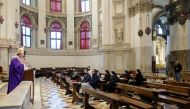 The Patriarch Francesco Moraglia celebrates mass behind closed doors in Venice with only the clerical staff allowed, Venice, Italy, March 1, 2020. Reuters/Manuel Silvestri