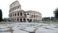 Very few people are seen in the area surrounding the Colosseum, which would usually be full of tourists, in Rome, Italy, March 2, 2020. Reuters/Remo Casilli
 