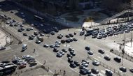 Vehicles are seen at an intersection to Changan Avenue, Beijing's main thoroughfare, as the country is hit by an outbreak of the new coronavirus, in China March 3, 2020. REUTERS/Carlos Garcia Rawlins