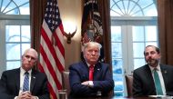 U.S. President Donald Trump is flanked by Vice President Mike Pence and Health and Human Services (HHS) Secretary Alex Azar as Trump hosts a meeting of the coronavirus task force with pharmaceutical executives to discuss developing a coronavirus vaccine, 