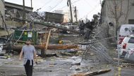 A man views damage in an alley behind Woodland Street after a tornado touched down in Nashville, Tennessee, US March 3, 2020. Reuters/Harrison McClary