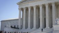 Members of the public wait in line outside the US Supreme Court for a chance to hear oral arguments inside the court on March 2, 2020 in Washington, DC.  Drew Angerer/Getty Images/AFP
