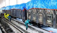Workers disinfecting freight trains to prevent the spread of the COVID-19 coronavirus in Sinuiju, North Pyongan Province, North Korea in a picture released  on March 4, 2020. AFP / KCNA via KNS 
