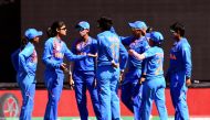 India's Radha Yadav (2/L) celebrates with teammates after dismissing Sri Lanka batswoman Chamari Atapattu during their Twenty20 women's World Cup cricket match in Melbourne on February 29, 2020. / AFP / WILLIAM WEST /