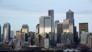  The Seattle skyline is pictured from a Washington State Ferry following a statement from ferry officials asking riders to consider staying in their vehicles when driving onboard and other steps to minimize coronavirus exposure in Seattle, Washington, U.S