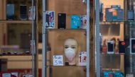 A surgical mask is on a sale in a mobile phone shop in Hanau, western Germany, on March 4, 2020. / AFP / John MACDOUGALL 