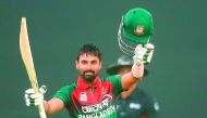 Bangladesh’s Liton Das celebrates after scoring a century (100 runs) during the third one day international (ODI) cricket match between Bangladesh and Zimbabwe at the International Cricket Stadium in Sylhet on March 6, 2020. AFP
 