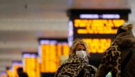 A woman wears a protective face mask at Roma Termini railway station, after the Italian government imposed a virtual lockdown on the north of the country, in Rome, Italy, March 8, 2020. REUTERS/Yara Nardi