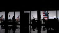 FILE PHOTO: American Airlines planes are seen as passengers wait at O'Hare International Airport in Washington, DC. AFP / Brendan Smialowski