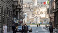 Pope Francis walks in a deserted Rome to pray at two shrines for the end of the coronavirus pandemic, in Rome, Italy March 15, 2020. Vatican Media / Reuters