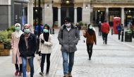 People wearing protective face masks in Covent Garden, London as the number of coronavirus cases grow around the world. London, Britain, March 17, 2020. REUTERS/Dylan Martinez