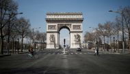 A view shows the deserted Arc de Triomphe as lockdown is imposed to slow the spreading of the coronavirus disease (COVID-19) in Paris, France, March 18, 2020. REUTERS/Benoit Tessier