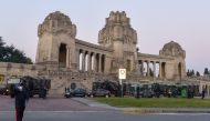 This photo provided by Italian news agency Ansa on March 19, 2020 shows Italian Army trucks parked outside the Monumental cemetery of Bergamo, Lombardy on March 18, 2020, mobilized to transport and bring about sixty coffins to crematoriums in other region