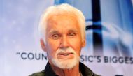 FILE PHOTO: Kenny Rogers poses backstage after accepting the Willie Nelson Lifetime Achievement award at the 47th Country Music Association Awards in Nashville, Tennessee, U.S., November 6, 2013. Reuters/Eric Henderson/File Photo