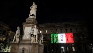 The Palazzo Marino building is seen iluminated with the colours of the Italian flag as the spread of coronavirus disease (COVID-19) continues, in Milan, Italy March 20, 2020. REUTERS/Daniele Mascolo
