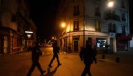 Municipal police officers patrol during a curfew in Colombes, near Paris on March 22, 2020 on the sixth day of a strict nationwide confinement seeking to halt the spread of the COVID-19 infection caused by novel coronavirus. / AFP / FRANCK FIFE