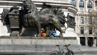 A delivery man rests in Place de la Republique during the Coronavirus lockdown in Paris, France on March 25, 2020. ( Geoffroy Van Der Hasselt - Anadolu Agency )