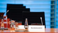 The empty chair of German Chancellor Angela Merkel is seen as she participates in the weekly cabinet meeting by video conference at the Chancellery in Berlin, on March 23, 2020. AFP / POOL / FABRIZIO BENSCH