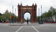 People walk near Arc de Triomf during the outbreak of the coronavirus disease (COVID-19), in Barcelona, Spain, March 31, 2020. REUTERS/Nacho Doce
