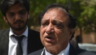 Khawja Naveed, defence lawyer of Omar Sheikh, who was convicted to death sentence over the killing of US journalist Daniel Pearl, speaks to media representatives after a court verdict in Karachi on April 2, 2020. AFP / Asif Hassan 