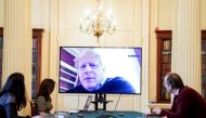 Britain's Prime Minister Boris Johnson appears on a monitor for the coronavirus disease (COVID-19) meeting in London, Britain March 28, 2020 Andrew Parsons/10 Downing Street/Handout via REUTERS