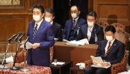 Japan's Prime Minister Shinzo Abe (front L) delivers a report to committee members of the Lower House in Tokyo on April 7, 2020 before declaring a state of emergency due to the COVID-19 coronavirus. Japan OUT / AFP / JIJI PRESS / STR