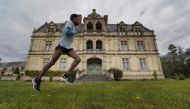TOPSHOT - French half marathon runner Yosi Goasdoue trains in the park of the Castle of La Bourdaisiere, where he is staying during a strict lockdown in France aimed at curbing the spread of COVID-19 (novel coronavirus), on April 3, 2020, in Montlouis-sur