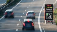 Cars drive past an information sign on the motorway ahead of the Easter weekend during the coronavirus disease (COVID-19) outbreak in Lausanne, Switzerland, April 8, 2020. The board reads : 