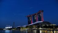 :The letters and symbol SG Love, lights the facade of Marina Bay Sands as message of hope amid the nation’s fight against COVID-19 coronavirus in Singapore on April 10 , 2020. / AFP / ROSLAN RAHMAN
