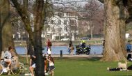 :A police motor cycle controls the area along the city Alster lake in the northern German city of Hamburg on Easter Sunday, on April 12, 2020 amid the spread of the novel coronavirus COVID-19.  / AFP / MORRIS MAC MATZEN