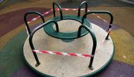 :A children's merry-go-round is seen cordoned off during lockdown amid the coronavirus disease (COVID-19) outbreak, in Madrid, Spain, March 22, 2020. Picture taken March 22, 2020. REUTERS/Susana vera