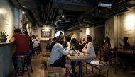 Customers eat at Mana Cafe in Wan Chai, Hong Kong, China April 14, 2020. Picture taken April 14, 2020. REUTERS/Pak Yiu