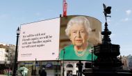 A message from Britain's Queen Elizabeth II is displayed on a screen in Piccadilly Circus, as the spread of the coronavirus disease (COVID-19) continues, London, Britain, April 19, 2020. REUTERS/John Sibley
